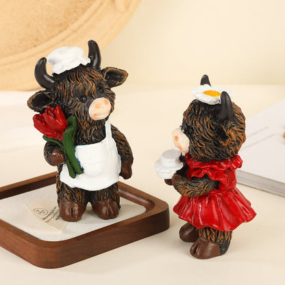 Desktop ornaments featuring a pair of cows as decorative items